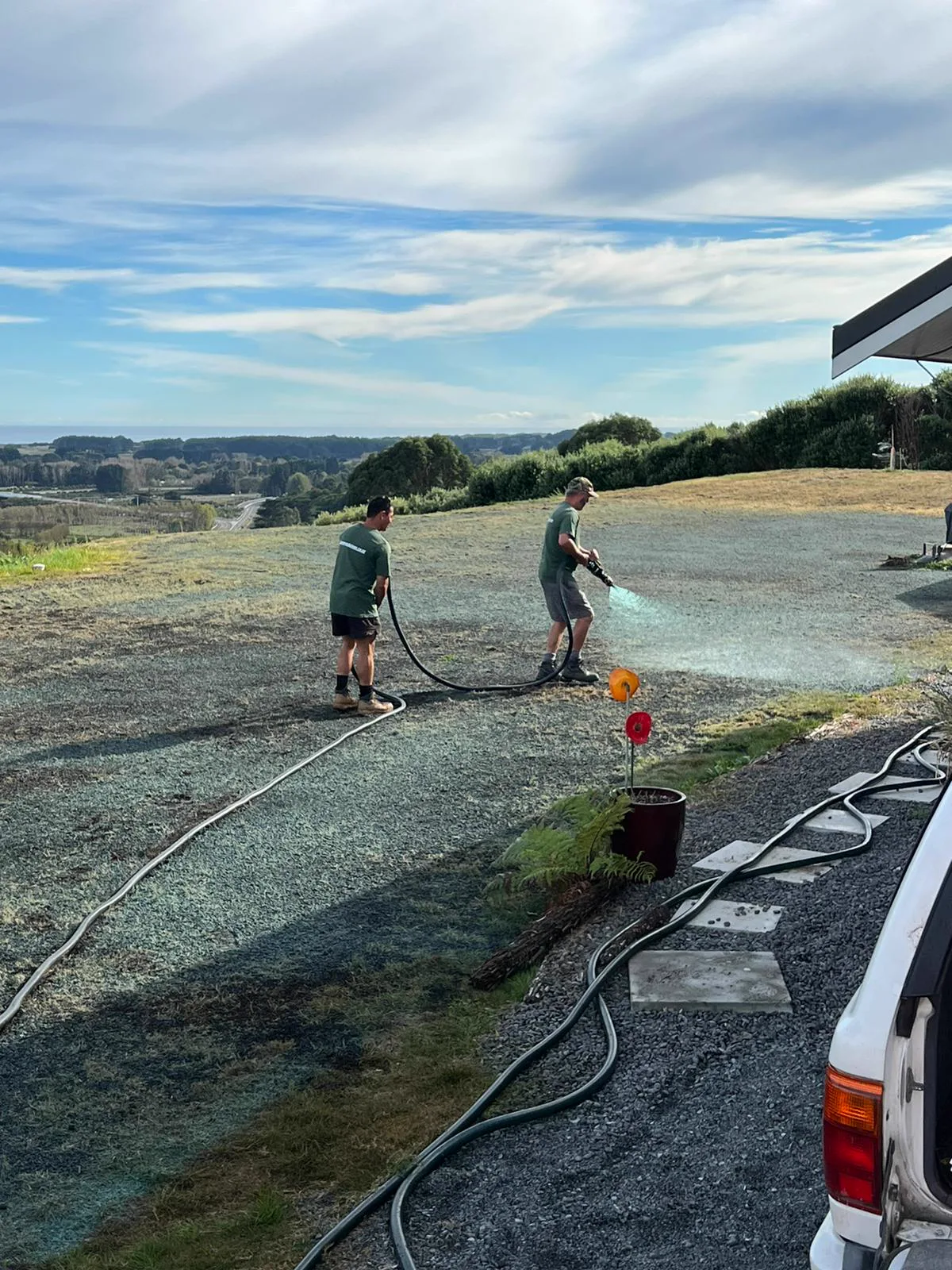 Hydroseed slurry being applied to a new lawn