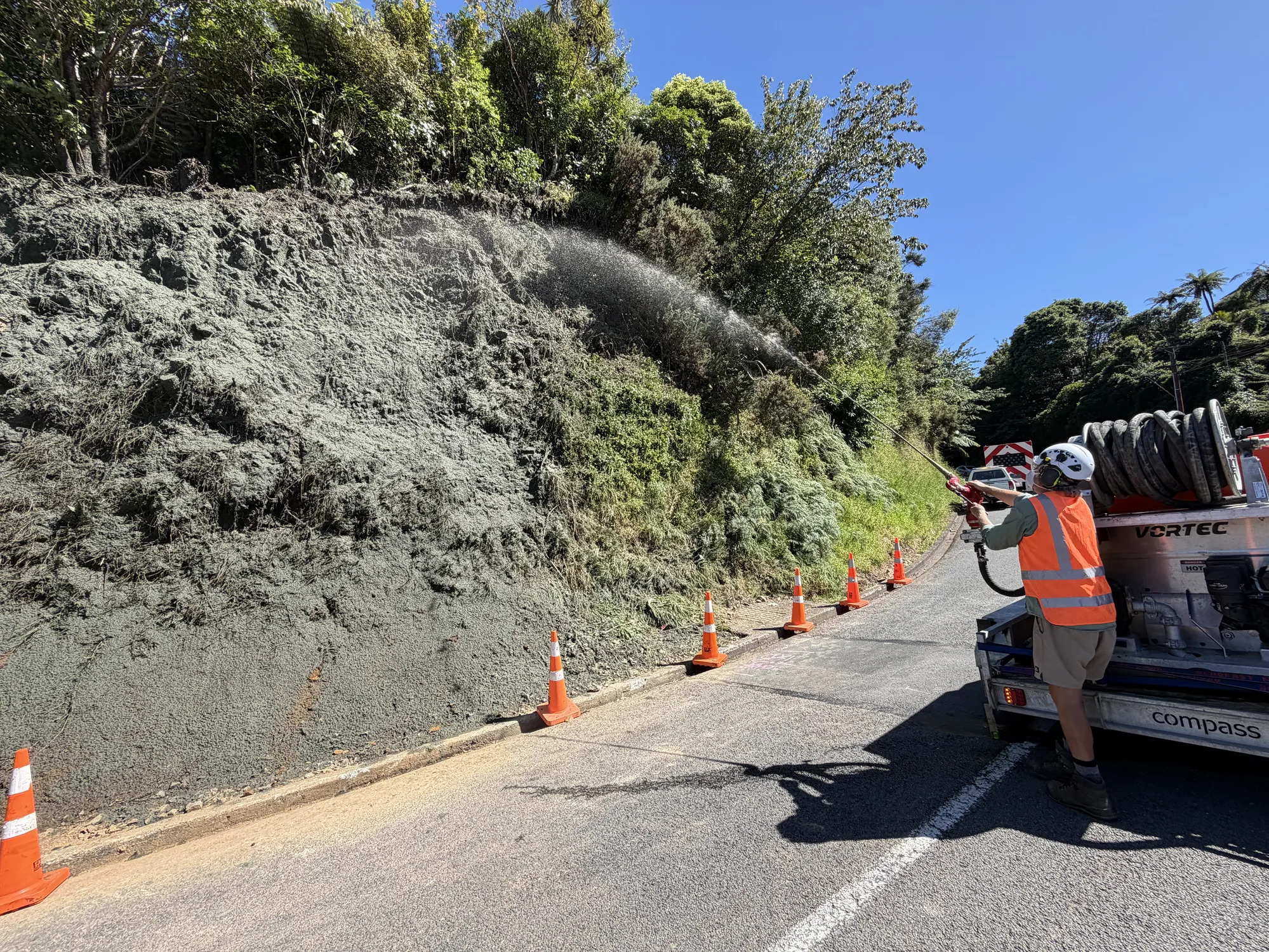 Street works slope stabilised with hydroseed erosion control